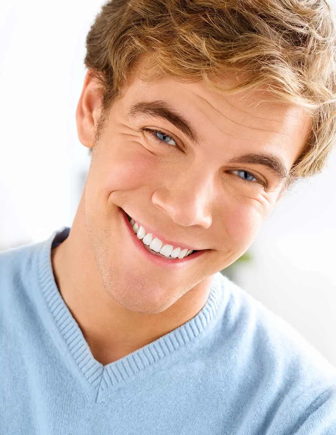 Handsome man with a confident smile after composite bonding treatment