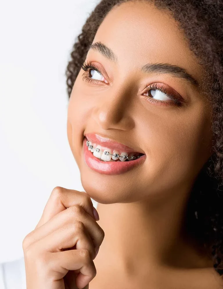 Woman smiling with metal braces