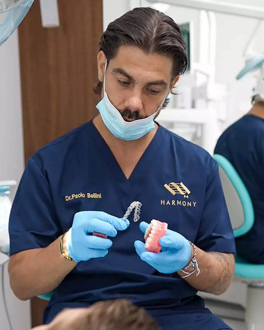 A photo of Italian Orthodontist,  Dr. Paolo Bellini, with a patient at Harmony Medical Center in Dubai