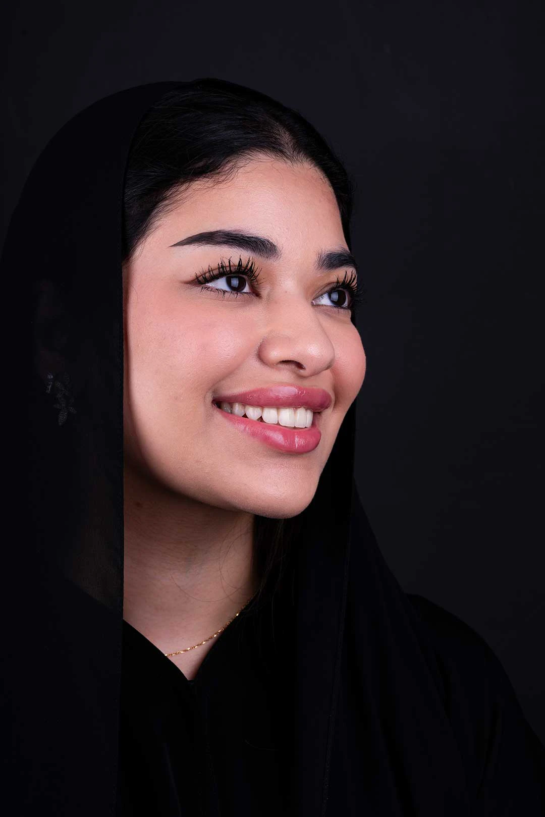 Confident woman smiles confidently