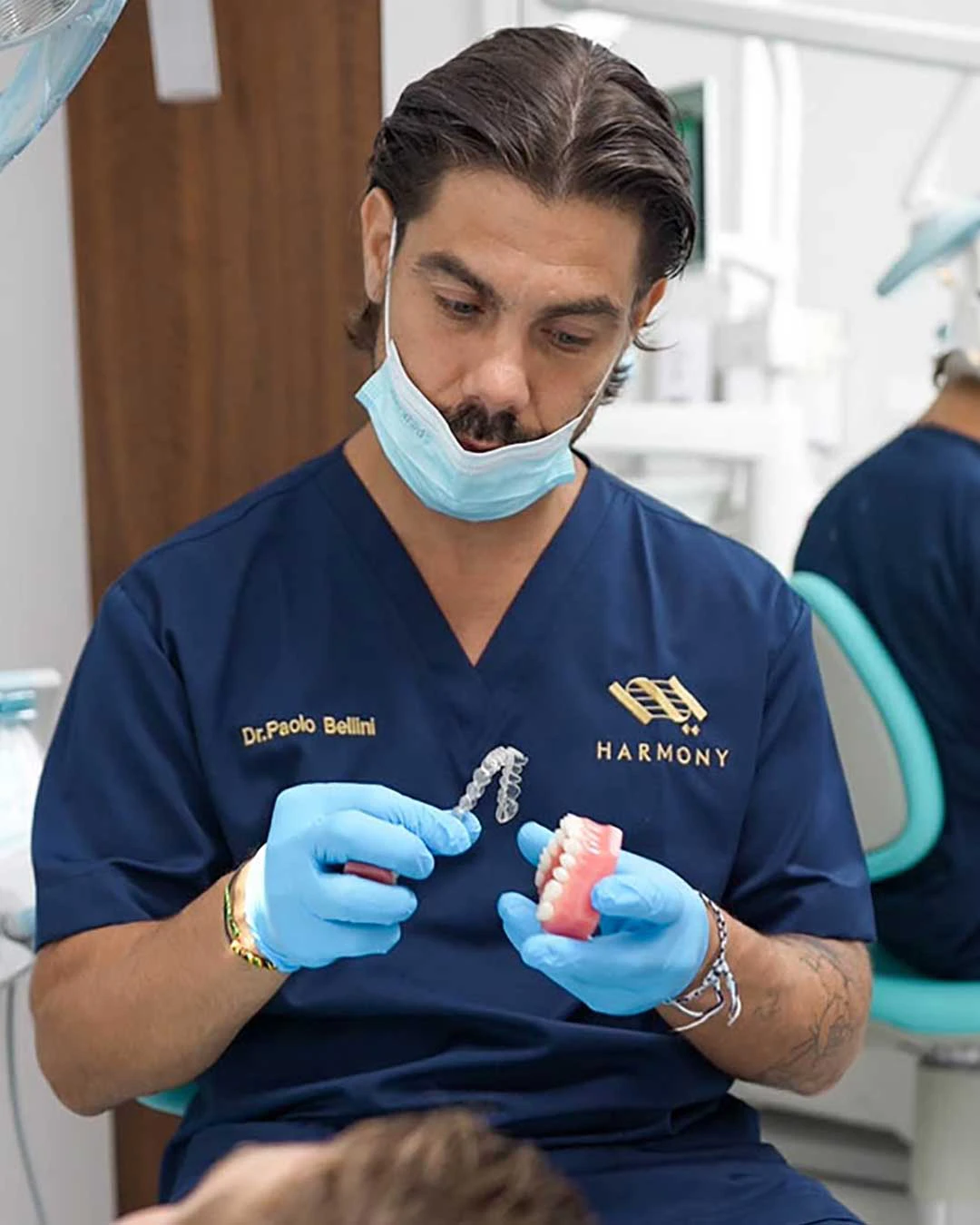A photo of Italian Orthodontist,  Dr. Paolo Bellini, with a patient at Harmony Medical Center in Dubai