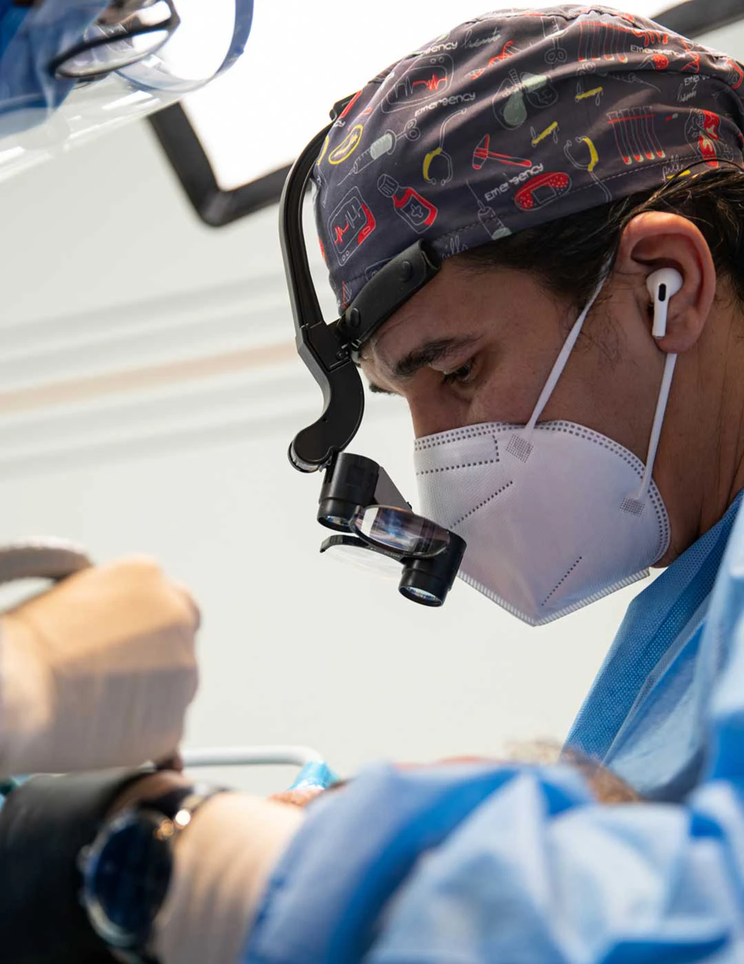 A photo of Dr. Ahmad Al Jazairi, Harmony Medical Center's Head Oral & Maxillofacial Surgeon with a patient.