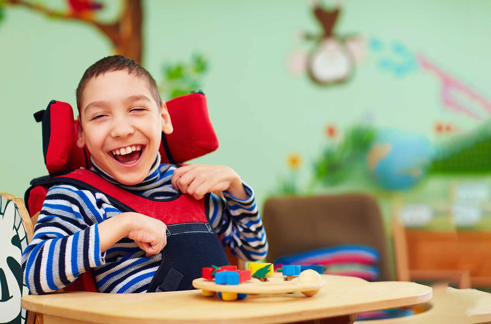 Child with special needs smiling during a gentle dental visit at Harmony Medical Center in Dubai